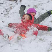 Children in Glasgow enjoy the snow after temperatures dipped overnight