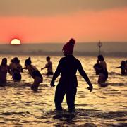 Several hundred swimmers took a sunrise dip in the North Sea at Portobello Beach