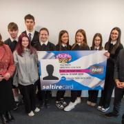Transport Minister Fiona Hyslop and Active Travel Minister Patrick Harvie meet a group of school students who have benefited from free bus travel for under 22s