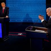 Joe Biden answers a question as President Donald Trump listens in 2020