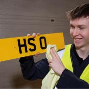 The HS 0 number plate is shown by an East Renfreshire Council worker