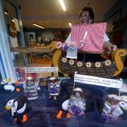 Eleanor Arthur adjusts her window display at Blyde Welcome in Lerwick town centre, as their display celebrates the first time females will participate in the Jarl Squad for Up Helly Aa