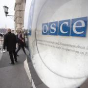 The logo of the Organization for Security and Co-operation in Europe (OSCE) pictured in front of the Hofburg Palace in Vienna, Austria