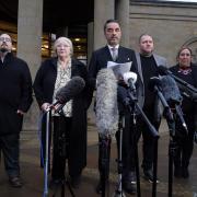 Solicitor Aamer Anwar, beside mother Margaret Caldwell and other family members