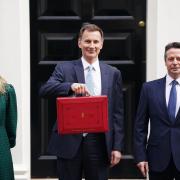 Chancellor Jeremy Hunt standing in Downing Street ahead of the Spring Budget