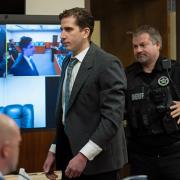 Bryan Kohberger, accused of murder, arrives for a hearing on cameras in a courtroom in Moscow, Idaho
