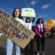 FOR SUNDAY HERALD. Climate Strike protest in George square, Glasgow. Young people pictured protesting to raise awareness of climate change...Pictured from left are- Anna Warren age 17 who attends Balfron high school,  Evie Hylands age 15 and Nancy