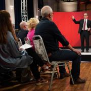 Keir Starmer faces members of the public during a General Election event