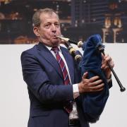 Alastair Campbell plays the bagpipes to mark 25 years of the Good Friday Agreement in Belfast in 2023