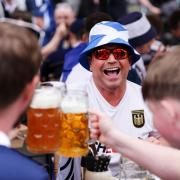 Scotland and Germany fans enjoy a drink at Marienplatz square, Munich.