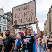 A LGBT Youth Scotland volunteer takes part in Edinburgh Pride