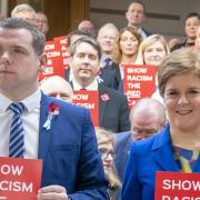 Douglas Ross and Nicola Sturgeon pose for a Show Racism the Red Card campaign in November 2022