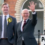 John Swinney arrived at a polling station to cast his vote in the General Election this morning