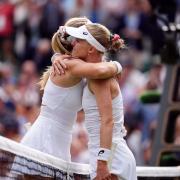 Katie Boulter and Harriet Dart embrace at the net after their match