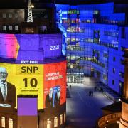 The results of the General Election exit poll projected onto the BBC building in London
