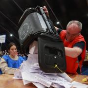 A ballot box is emptied at the Titanic Exhibition Centre, Belfast