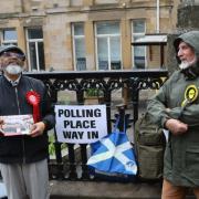 Labour and SNP campaigners outside a polling station in Glasgow