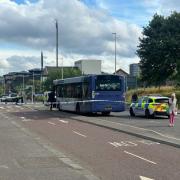 Police tape put around Glasgow bus after passenger dies