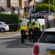 A view of police at the scene in Ashlyn Close, Bushey, Hertfordshire
