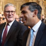 Prime Minister Keir Starmer and Leader of the Opposition Rishi Sunak walking through the Member's Lobby of the Houses of Parliament