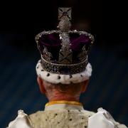 King Charles III wears the Imperial State Crown on the day of the State Opening of Parliament at the Palace of Westminster
