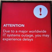 A warning message at Gatwick Airport amid a global IT outage