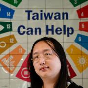 Taiwans Digital Minister Audrey Tang posing for a photo at an innovation centre in Taipei