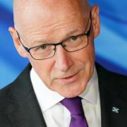 John Swinney pictured at a press conference following the General Election