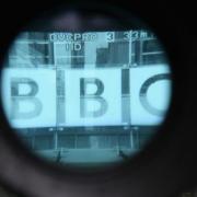 File photo of the BBC office building seen through a camera lens