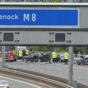 Two police officers were raced to hospital after a smash on Glasgow's M8