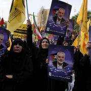 Iranian protesters attend a demonstration to condemn the killing of Hamas leader Ismail Haniyeh