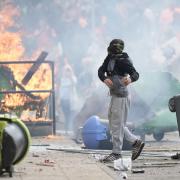 Far-right protesters are seen during riots outside of the Holiday Inn Express in Manvers, which is being used as an asylum hotel,  in Rotherham