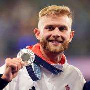 Josh Kerr with his silver medal following the Men's 1500m Final at the Stade de France