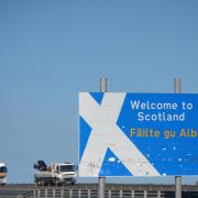 A vehicle passes the welcome to Scotland sign on the A1, near Berwick-upon-Tweed