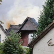 Smoke billowed from a large hole in the roof after the property was struck by lightning