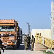 Trucks carrying humanitarian aid at the Kerem Shalom border crossing with the southern Gaza Strip