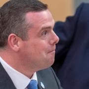 Douglas Ross has been accused of secretly plotting to run for Westminster for over a year