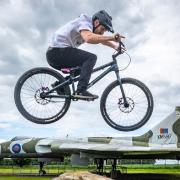 Cycling stunt team The Clan practice ahead of 360 Fest at the National Museum of Flight