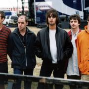 Oasis pictured before their 1996 Knebworth park gig