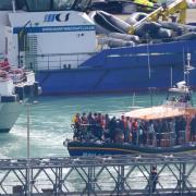 A group of people thought to be migrants are brought in to Dover, Kent, onboard the RNLI Dungeness Lifeboat following a small boat incident