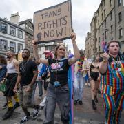 People take part in the Pride Edinburgh 2024 parade through Edinburgh city centre.