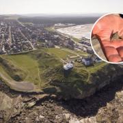 Burghead today, and John Ralph holding the Pictish ring after he found it