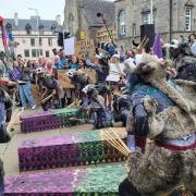 Hundreds of people gathered outside Holyrood on Thursday afternoon to protest against cuts to Scotland's culture budget