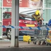 A car smashed through the entrance to a Tesco in Greenock on Friday night