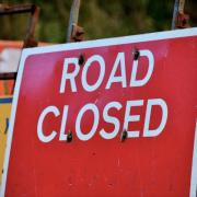 A Scottish road has remained closed after a vehicle caught fire