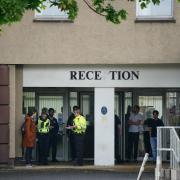 Police presence outside the Cairn Hotel in Bathgate, which is used to house asylum seekers.