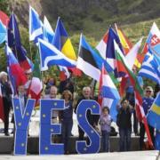 Members of the Yes for EU campaign group demonstrate outside the Scottish Parliament