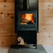 The Scottish Government has reversed a ban on wood-burning stoves in new-build homes