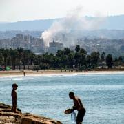 A cloud of smoke erupts during Israeli air strikes on a village south of Tyre in southern Lebanon