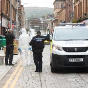 A 21-year-old man was found injured in a street on Saturday